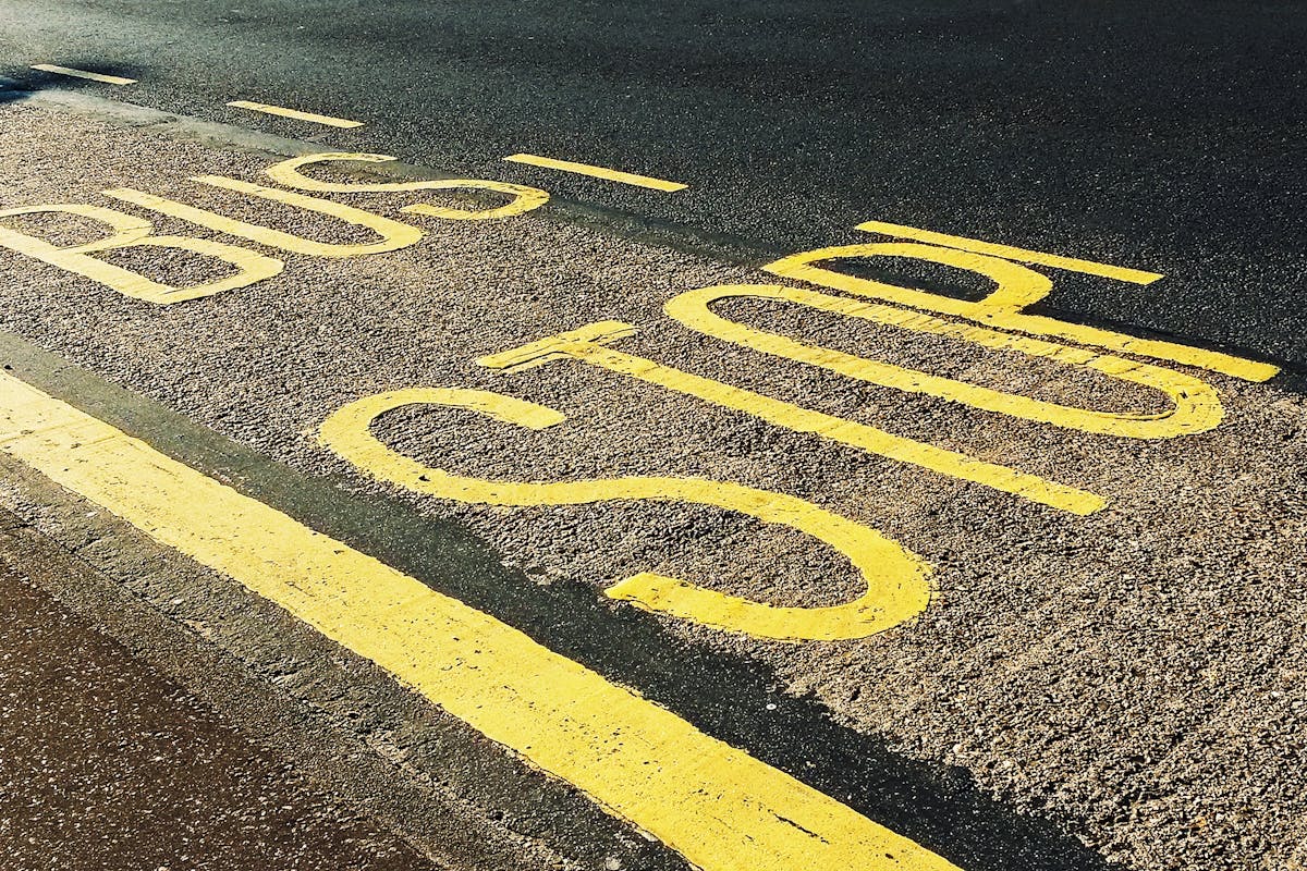 Bus Stop Printed on Asphalt Road