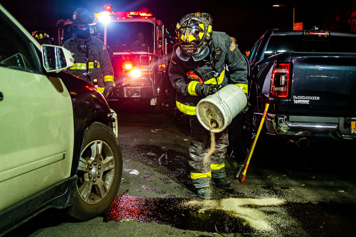 Firefighters pouring Solution on a Gas