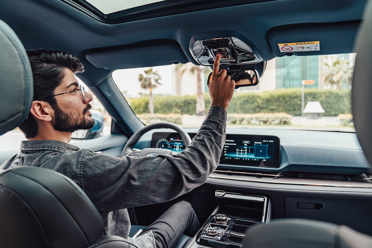 Man Operating Modern Car Interior in Erbil