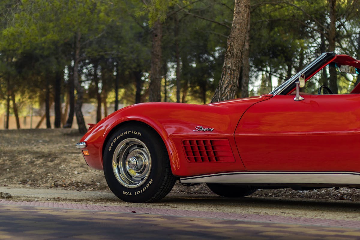Red Chevrolet Corvette on Road