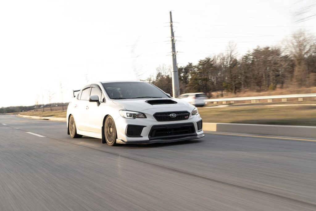 White Subaru Impreza on Road