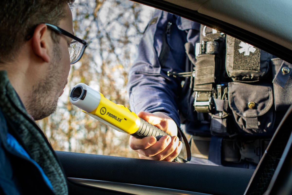 Police Officer During Breathalyzer Test at Traffic Stop