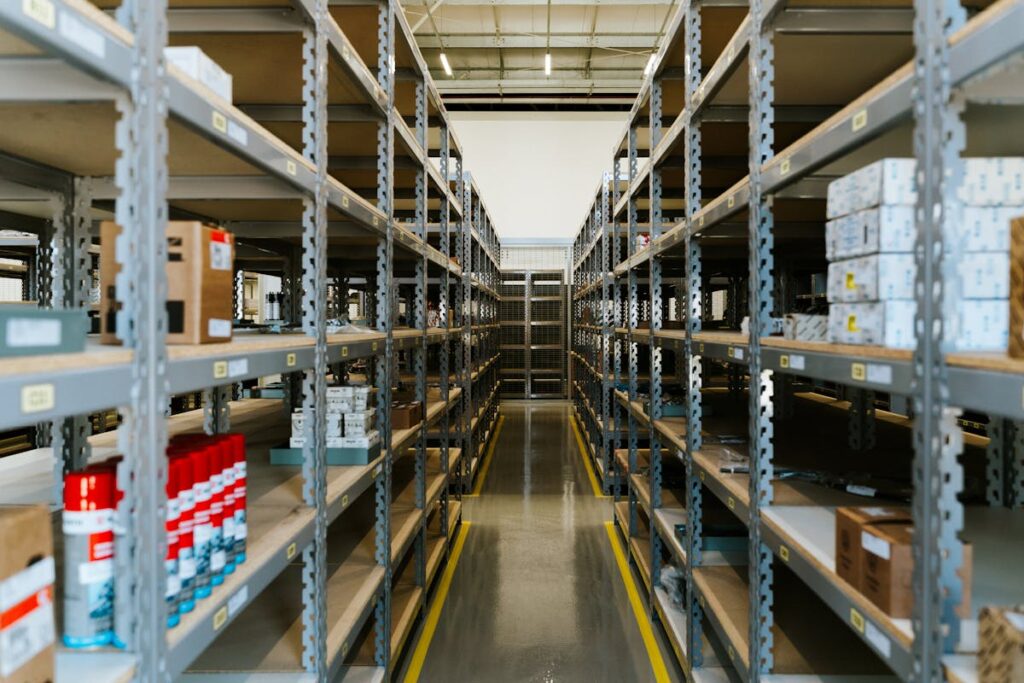 Narrow Walkway Between Metal Shelves