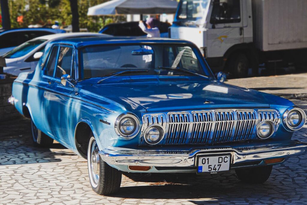 Vintage Blue Car Displayed Outdoors
