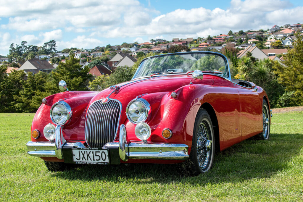 Red convertible Jaguar XK150 classic sports car